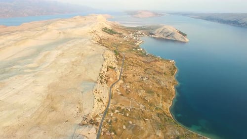 Aerial view of road through barren landscape of Pag island in Croatia