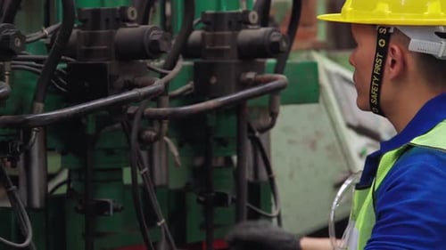 Smart Factory Worker Using Machine in Factory Workshop