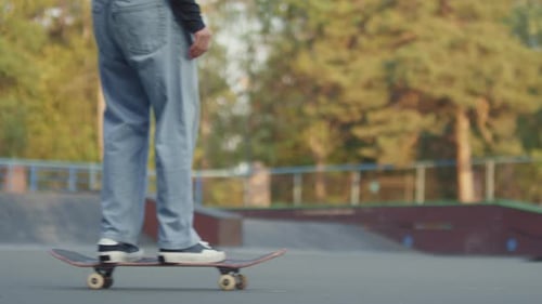 Skateboarder Rolling in Urban Skate Park