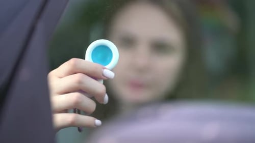 Woman Using Pop It or Simple Dimple in Car