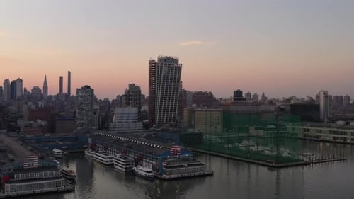 An aerial view of Manhattan's westside, early in the morning. The camera dolly in and pan right over