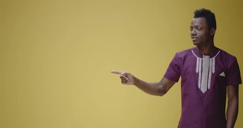 Smiling Young Adult Pointing to the Left