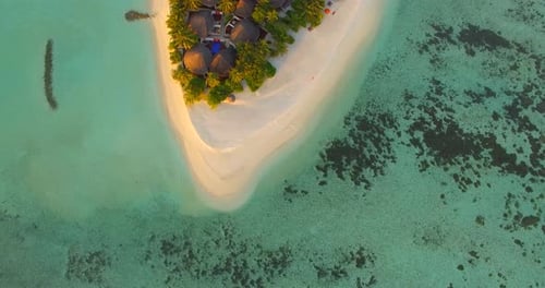 Aerial drone view of a scenic tropical island in the Maldives.