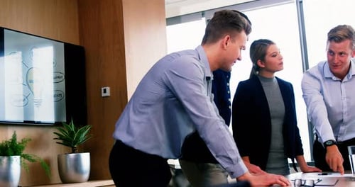 Diverse Team Collaborating on Business Strategy in Office