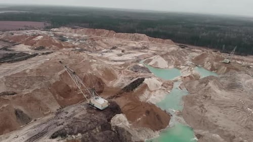 Vast Industrial Excavation with Turquoise Water Pools