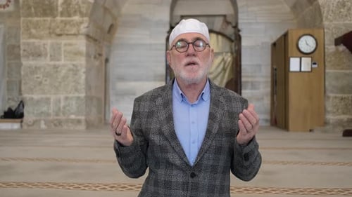 Senior Man Praying Peacefully in a Mosque