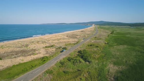Aerial View of Beautiful Sea Horizon and Sea Shore with Golden Sand Beach and Coastal Road