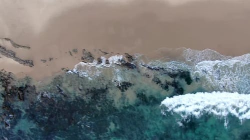 Aerial Top View of the Ocean Waves Washing on the Coast of the Pacific Ocean