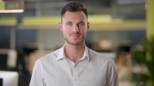 Handsome Young Adult in a Modern Office