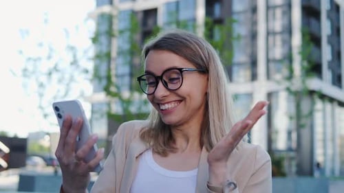 Excited Woman Celebrating Good News on Phone