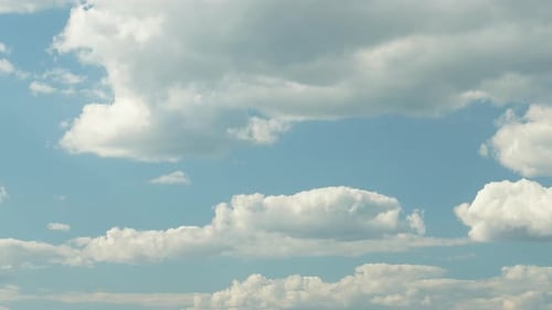 Blue Summer Sky with Dense Thick Thunderstorm Rain Clouds Moving Across the Heavens. Fast Cloud