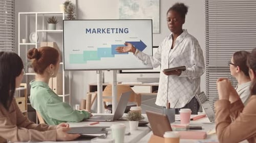 Woman Making Presentation on Marketing to Colleagues