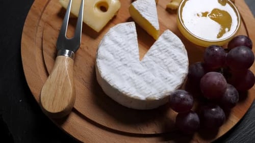 Cheese Board with Grapes, Honey and Almonds