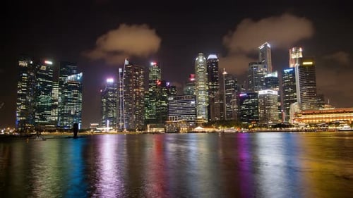 Singapore Skyscrapers with Reflection in Water Night Timelapse