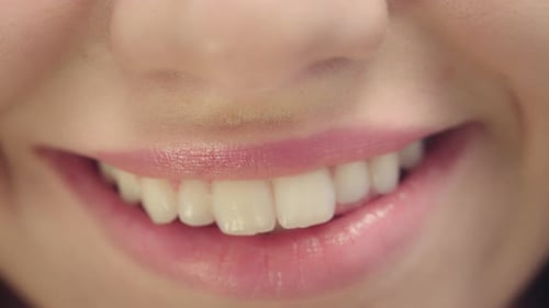 Smiling Female Mouth with White Teeth