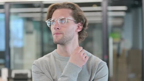 Man Thinking and Pondering in Office Environment