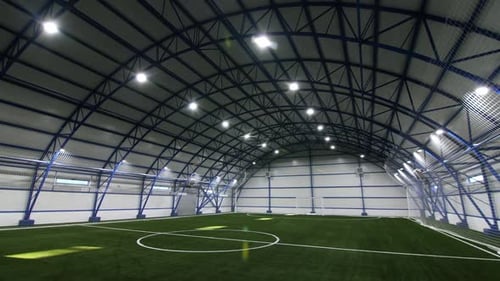 Indoor Football Field with White Marking and Gate at Stadium