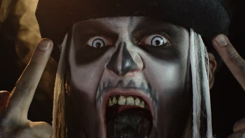 Man with Skeleton Makeup Screaming at Camera