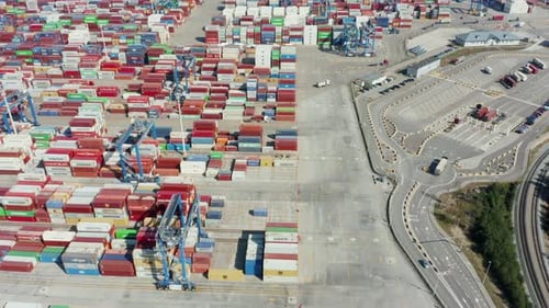 Seaport with Trucks with Trailers Approaching the Terminal for Loading