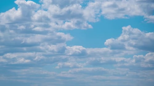Cumulus Cirrus Clouds Move in the Blue Sky. Time Lapse.
