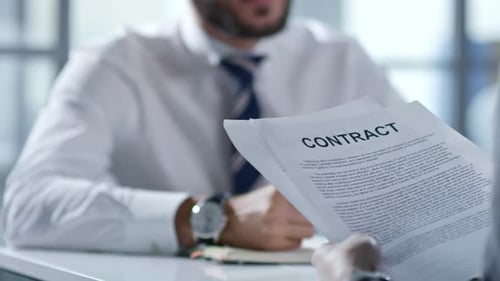 Business Partners Discussing Contract