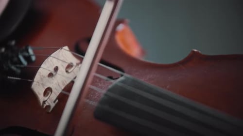 Close-Up of Violin Being Played with a Bow