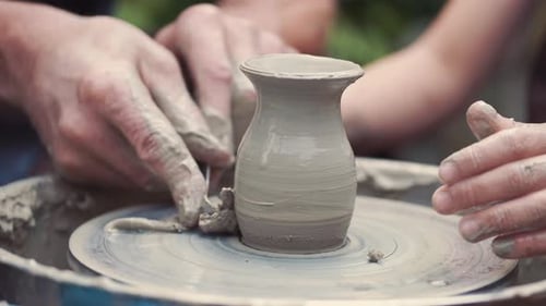 Close Up Hands Make Pitchers in Pottery