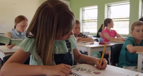 Children Working at Desks in School Classroom