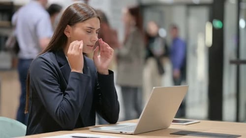 Businesswoman Working at Laptop in Modern Office