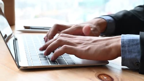 businessman typing a computer keyboard, working at the office or work from home
