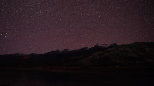 Time lapse of the mountain on the night and sky full with stars