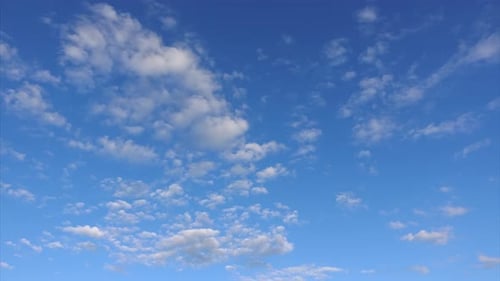 Fluffy White Clouds Drifting Across a Blue Sky