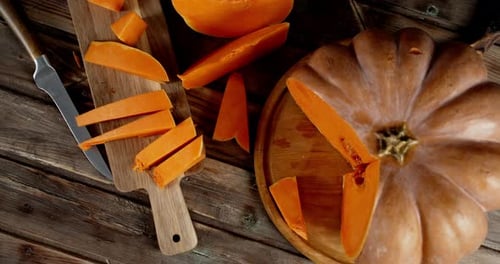 Pumpkin Slices on a Wood Cutting Board