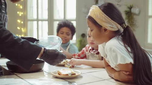 Chef Cooking with Children in Bright Kitchen