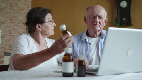 Elderly Couple Discussing Medication on Video Call