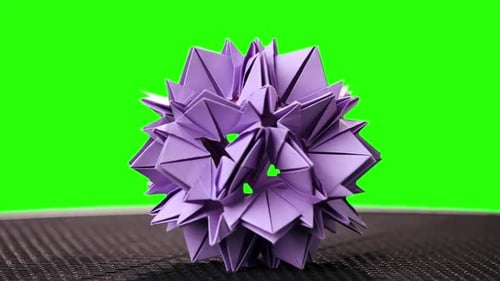 Violet Origami Flower on Green Screen.