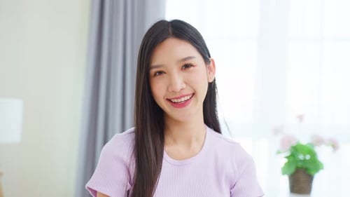 Smiling Young Woman Looking at the Camera