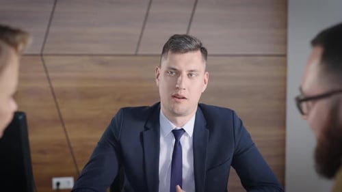 Three Business Professionals in a Corporate Meeting