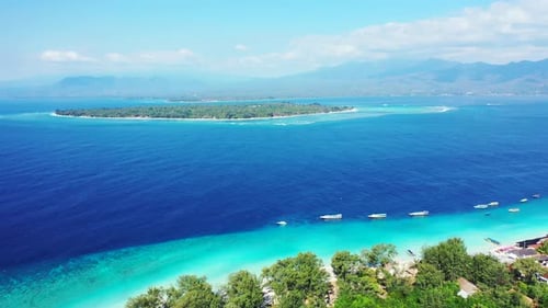 Wide angle overhead abstract view of a paradise sunny white sand beach and blue sea background