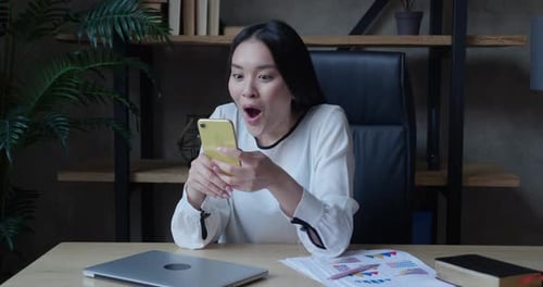 Woman Reacts to Good News on Cell Phone