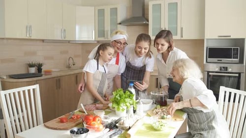 Family Prepares Meal Together in Sunny Kitchen