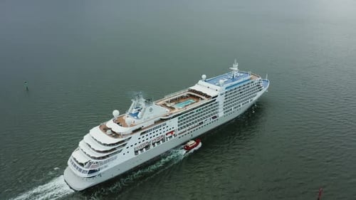 Aerial View of a Cruise Ship Sailing on the Ocean or Sea in Cloudy Weather