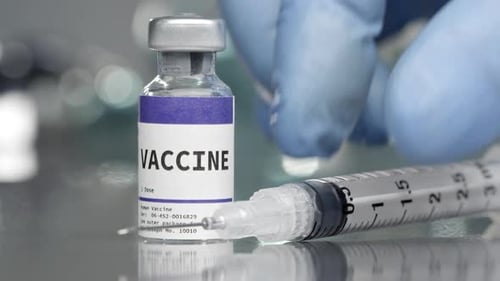 Vaccine Vial and Syringe in Hospital Setting