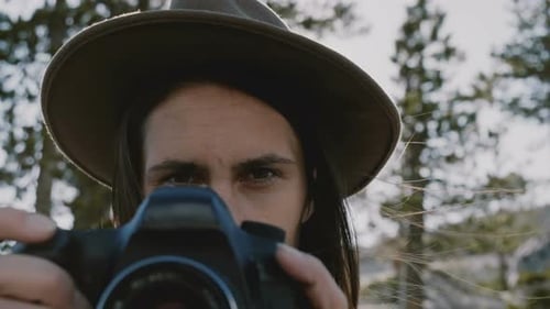 Atmospheric Close-up Portrait of Young Beautiful Photographer Girl with Camera Smiling at Yosemite