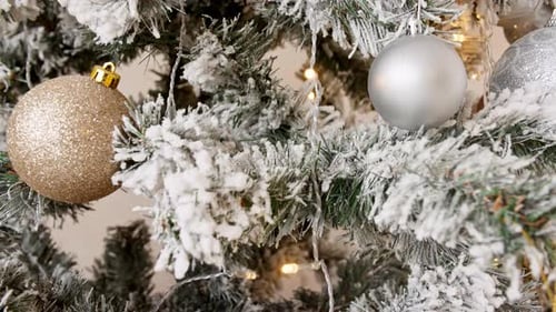 Elegant Christmas Tree Decoration with Baubles and Lights