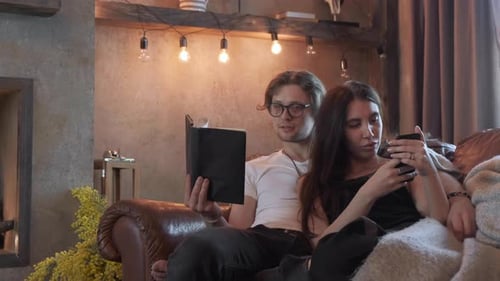 Couple Relaxing Together on Couch at Home