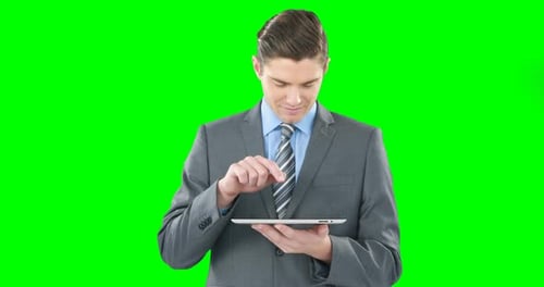 Young Adult Using Tablet on Green Screen
