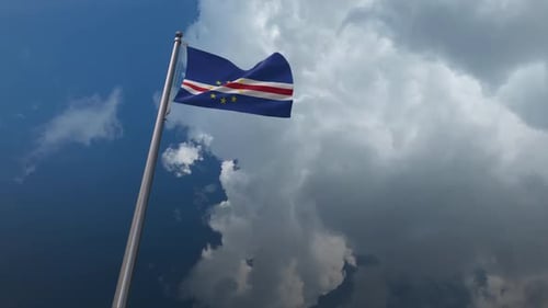 Cape Verde Flag Waving Against Dynamic Sky