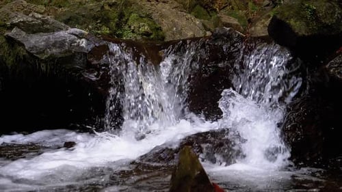 Mountain Creek. Water Moves Down Through Rocks in the Mountains