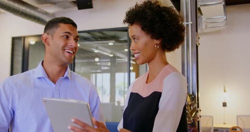 Business people discussing over digital tablet in modern office 4k